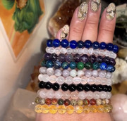Handmade crystal bracelet stack — rose quartz, lapis, tiger's eye, citrine